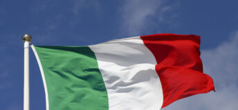 The Italian flag waving in the wind.