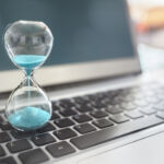 REC Europe’s Active Lenders: The submissions deadline is looming Hourglass on laptop computer concept for time management and countdown to deadline