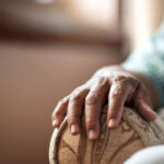 Sale of Emeis’ senior residences reduces company’s debt burden Elderly person sitting in armchair