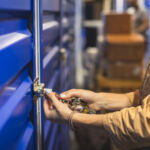 View of self storage warehouse, process of keeping and storing the goods and items in storage units, self-storage building, lock and key concept.