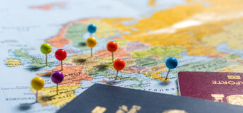 Map of Europe with coloured pins in it