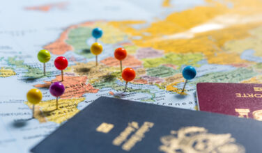 Map of Europe with coloured pins in it