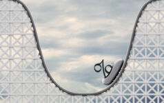 A rollercoaster with a percentage sign sat on the rollercoaster's cart