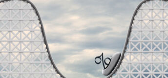 A rollercoaster with a percentage sign sat on the rollercoaster's cart